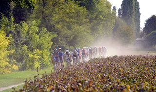 The pack rides during the first edition of the UCI Gravel World Championships 2022 between Vicenza and Cittadella northern Italy on October 9 2022 Photo by Massimo Fulgenzi AFP Photo by MASSIMO FULGENZIAFP via Getty Images