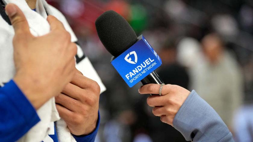 DETROIT, MICHIGAN - FEBRUARY 26: A detailed view of a hand holding a Fanduel Sports Network branded microphone during an interview after the Detroit Pistons defeated the Boston Celtics at Little Caesars Arena on February 26, 2025 in Detroit, Michigan. NOTE TO USER: User expressly acknowledges and agrees that, by downloading and or using this photograph, User is consenting to the terms and conditions of the Getty Images License Agreement. (Photo by Nic Antaya/Getty Images)