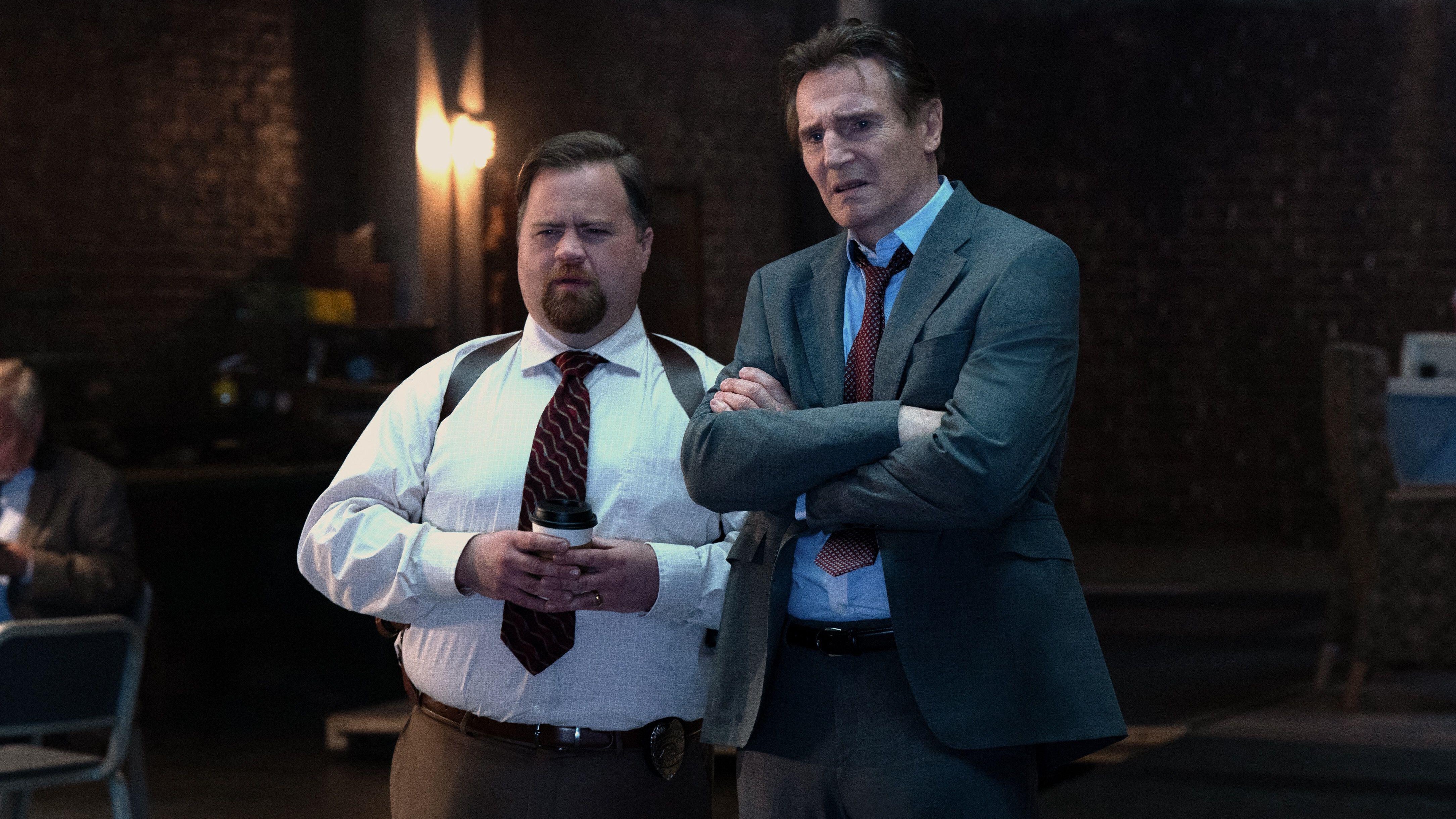 L-R: Ed Hocken Jr (Paul Walter Hauser) and Frank Drebin Jr. (Liam Neeson) stand next to one another in a scene from &quot;The Naked Gun&quot; (2025)