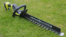 Ryobi 18V ONE+ Cordless 50cm Hedge Trimmer on grass