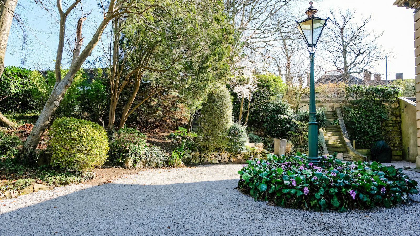 gravel driveway with lampost
