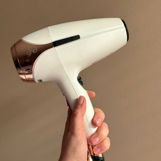 Laura holding ghd Helios Professional Hair Dryer - best hair dryers