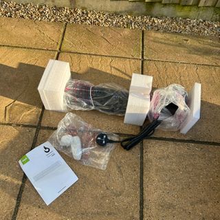 Gtech HeatWave Patio Heater in plastic and polystyrene packaging in garden