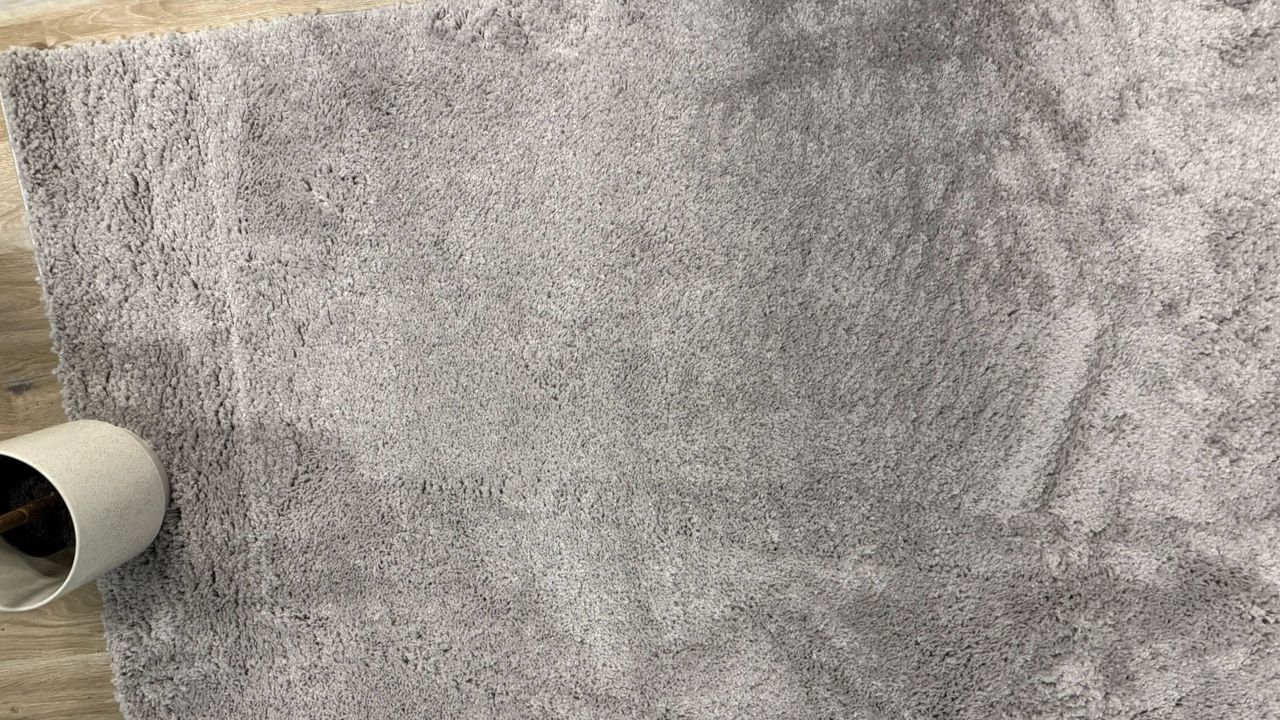 a photo of a carpet before and after cleaning hair
