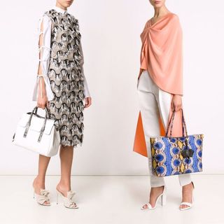 Models posing with handbags