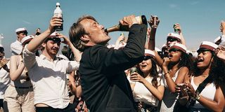 Mads Mikkelsen drinking in Another Round