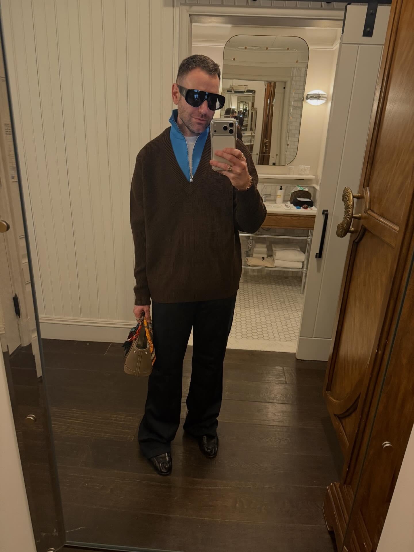 Who What Wear editor Bobby Schuessler wearing quarter-zip-sweater outfit.