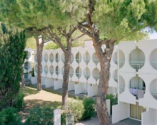 La Cité Oasis, a photographic series on La Grande Motte, shot by Charly Broyez & Laurent Kronental and showing sculptural, white and geometric modernist architecture in the south of france, surrounded by green spaces and in monumental scale