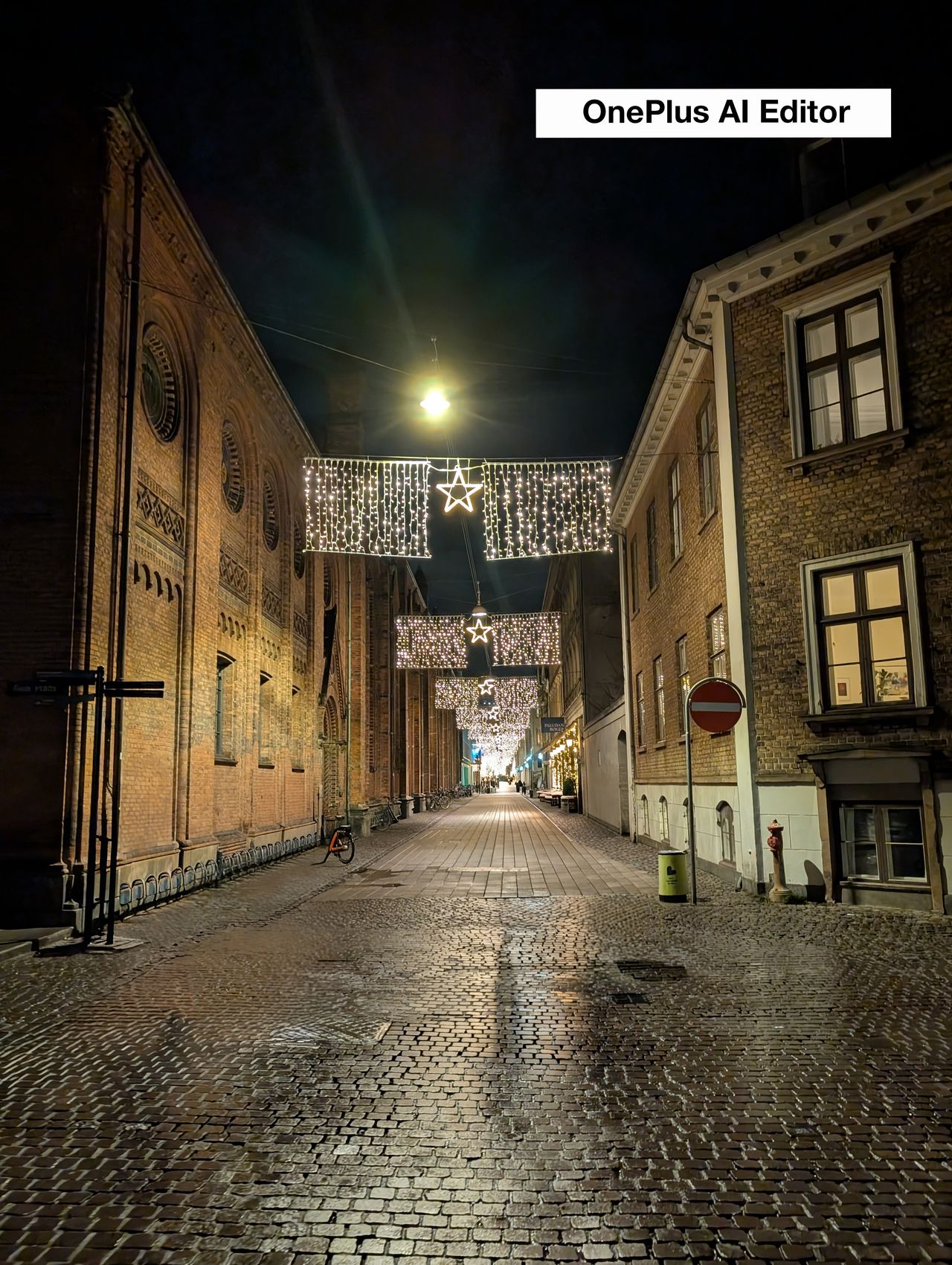A street at night lit with Christmas lights