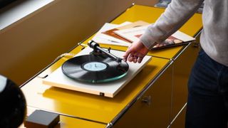 Pro-Ject T2 Super Phono on a yellow background