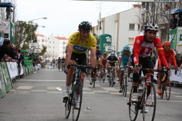 The yellow jersey rolls safely across the line.