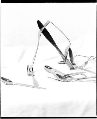 Cutlery forming still life photo by Veronica Viacava