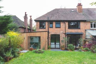 semi detached house with modern timber clad extension