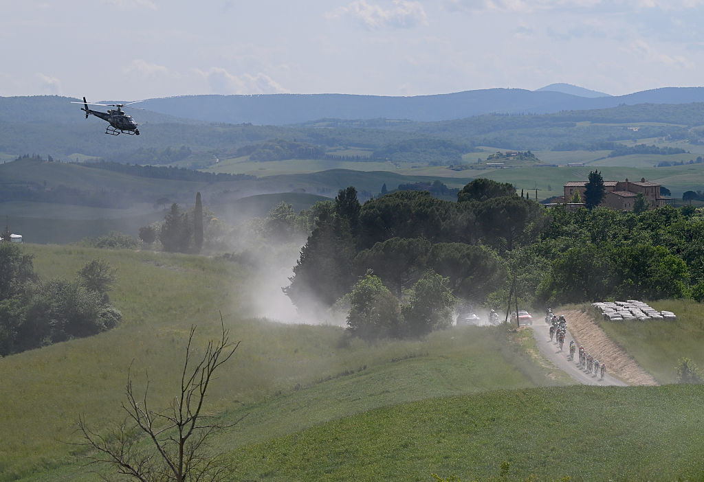 SIENA ITALY MAY 18 A general view of the peloton competing passing through a gravel strokes sector during the 108th Giro dItalia 2025 Stage 9 a 181km stage from Gubbio to Siena UCIWT on May 18 2025 in Siena Italy Photo by Tim de WaeleGetty Images