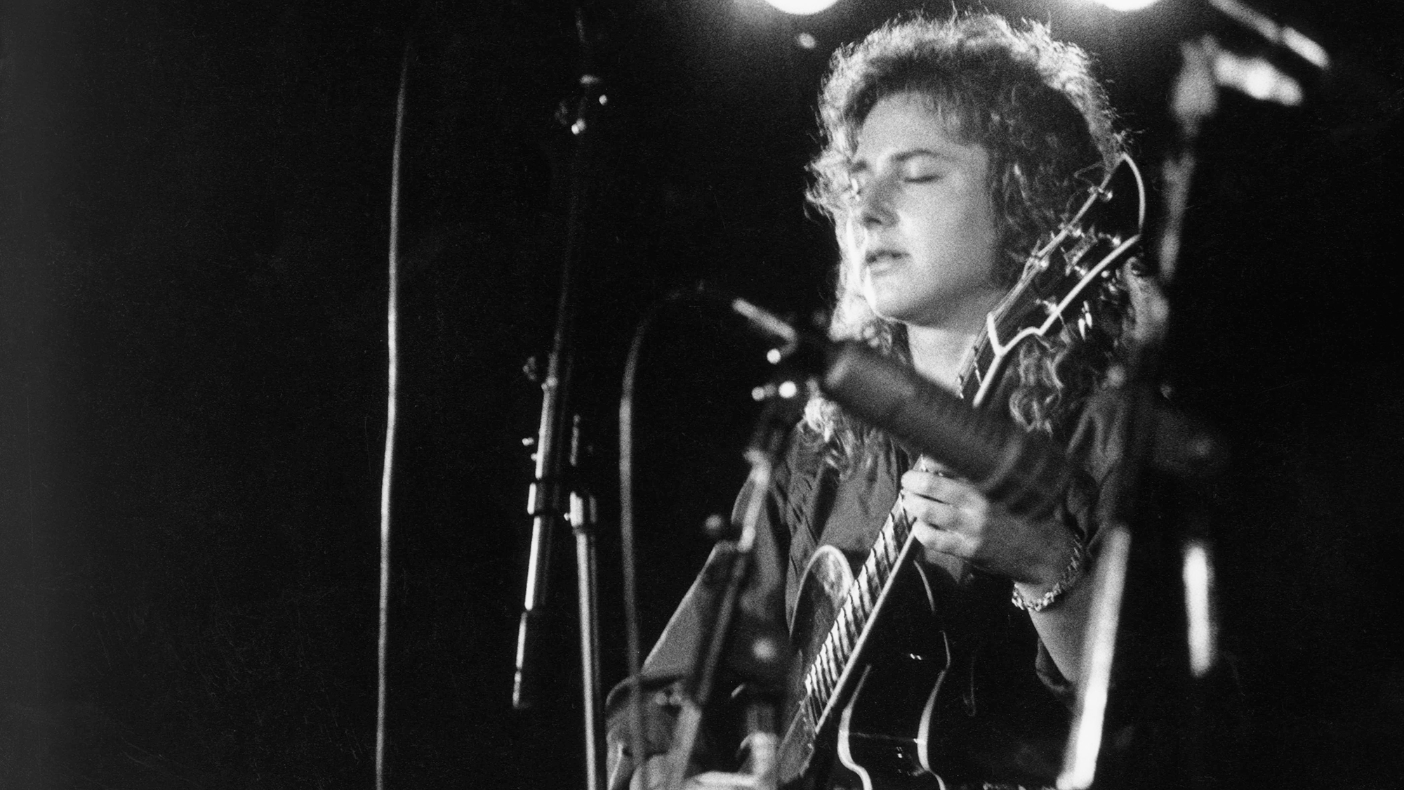 Emily Remler playing guitar on stage