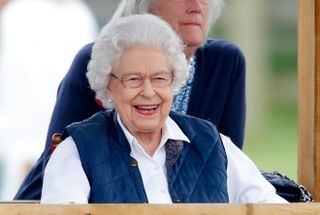 Queen Elizabeth II watches her horses compete in the Highland and Fells classes on day 2 of the Royal Windsor Horse Show