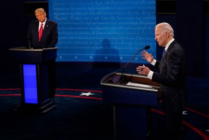 Democratic presidential candidate former Vice President Joe Biden answers a question as President Donald Trump listens during the second and final presidential debate at Belmont University on
