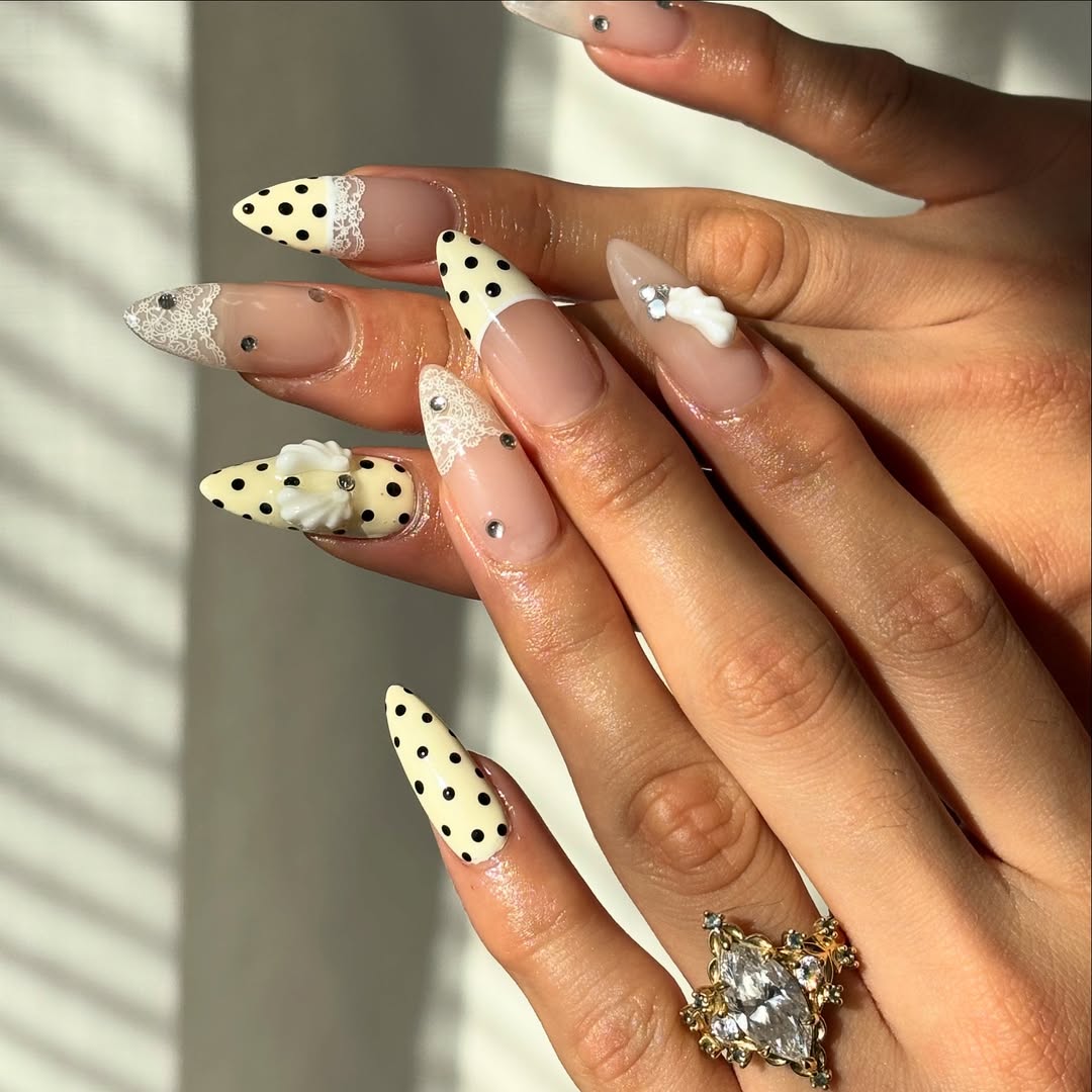 yellow polka dot and lace nails