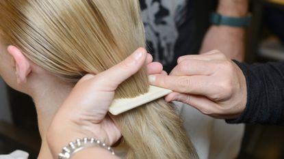 model combing hair