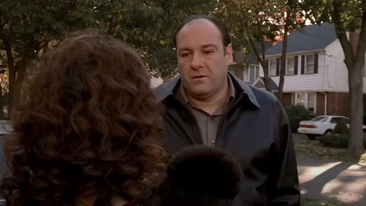 Tony Soprano talking to Angie holding her dog outside of her house on The Sopranos
