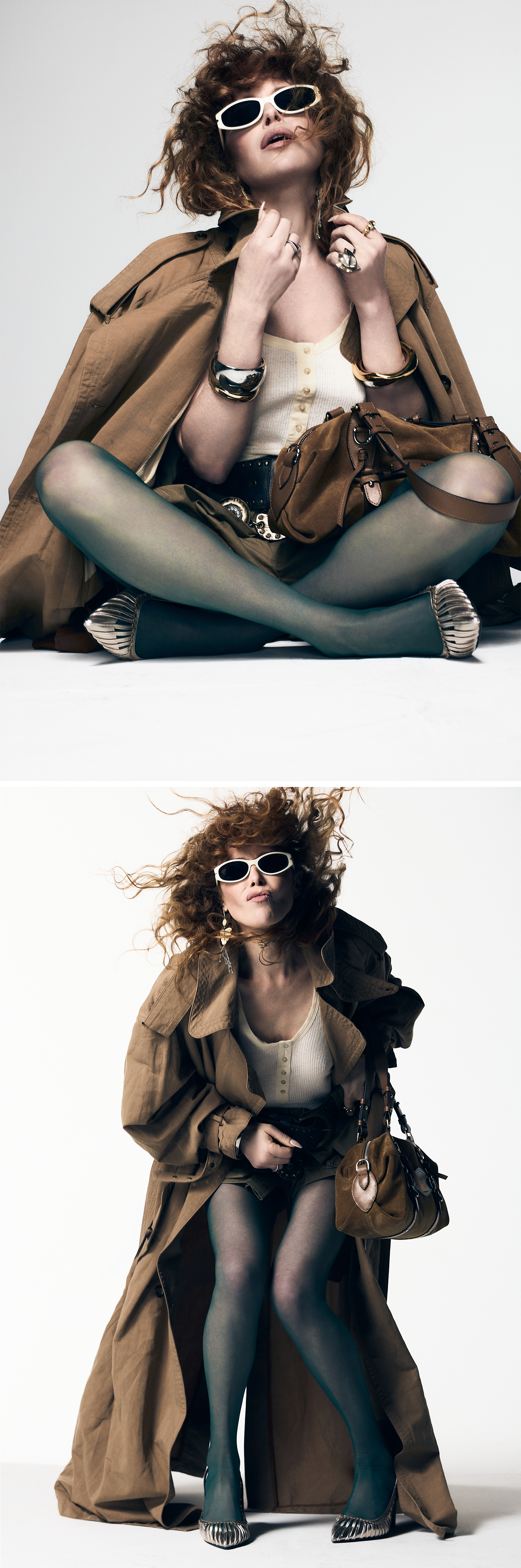 Natasha Lyonne photographed by Andrew Arthur for Who What Wear. She is sitting cross-legged wearing white sunglasses, a brown trench coat, a white tank top, and khaki shorts with a brown suede bag.