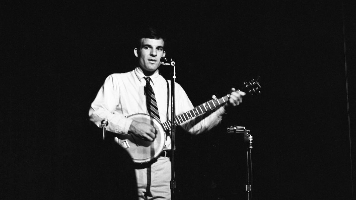 Steve Martin with a banjo on stage