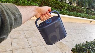 Anker Soundcore Motion X500 being carried by handle