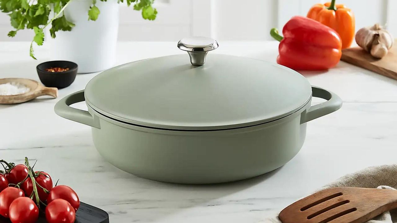 green casserole dish on kitchen worktop