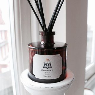cacao and vanilla diffuser in brown glass bottle