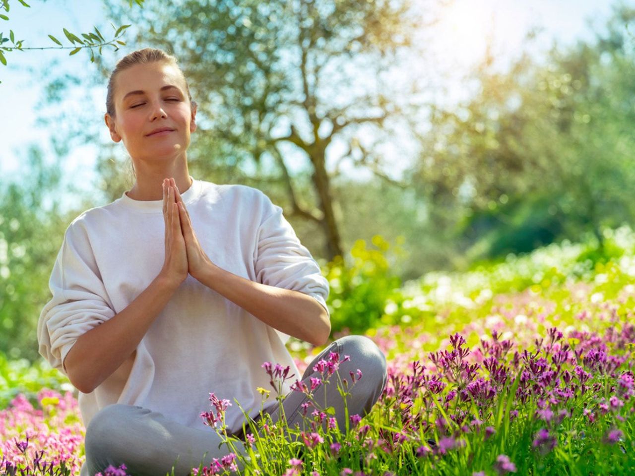 Lady Meditating In A Field Of Flowers