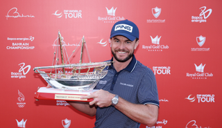 Laurie Canter holds the Bahrain Championship trophy