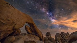 Rock arch in Joshua Tree National Park under the stars