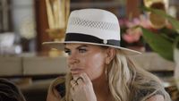 Heather wearing a hat being asked about Jen Shan in Ultimate Girls Trip