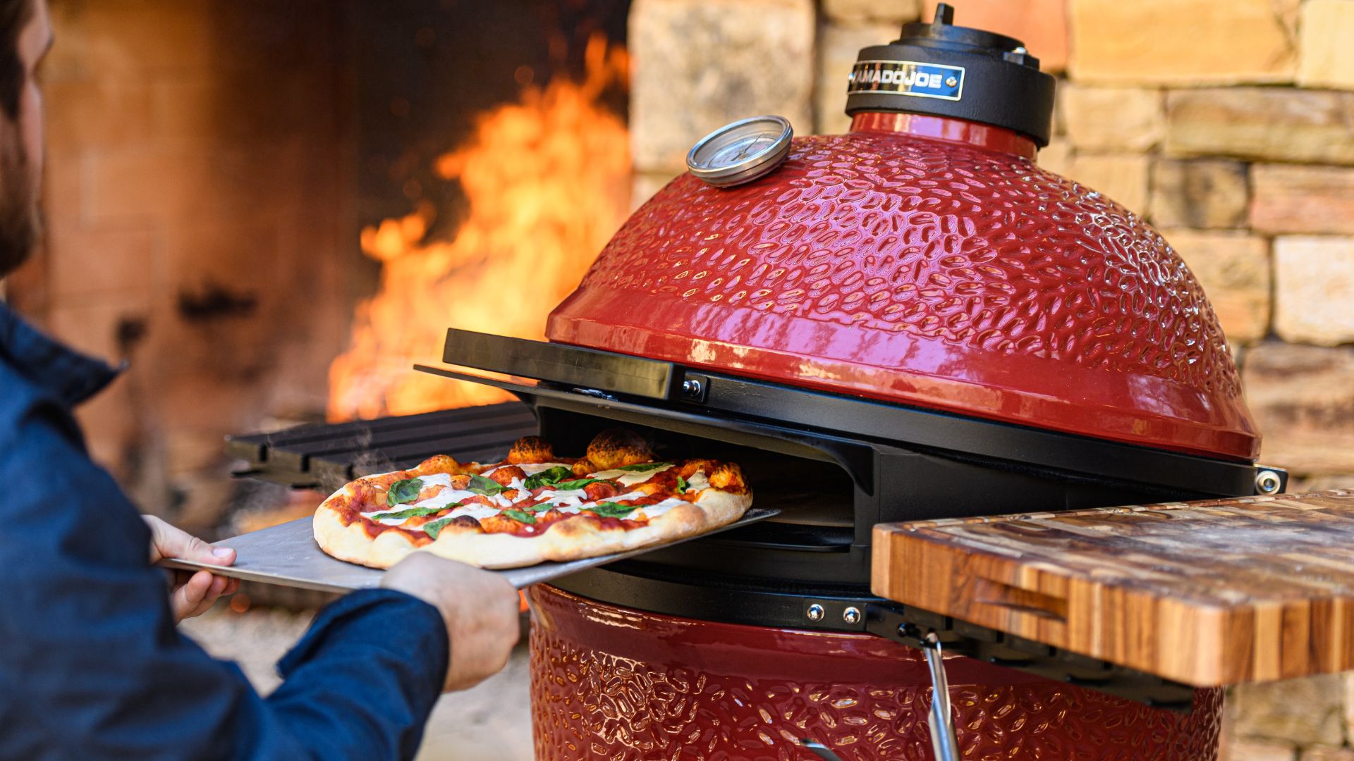 A red Kamado Joe grill