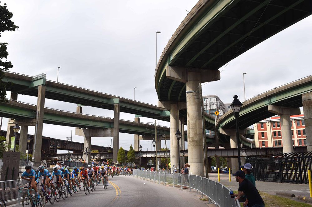 Peloton passes under the many road ways in Richmond