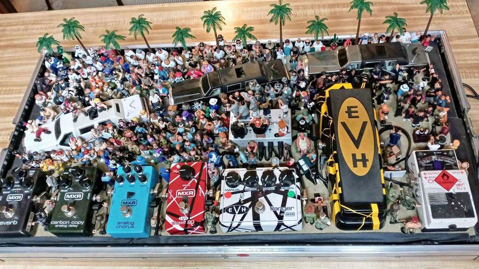 No, this isn’t Photoshopped. Some dude actually turned his pedalboard into a diorama of a raging outdoor show using $3k worth of figurines