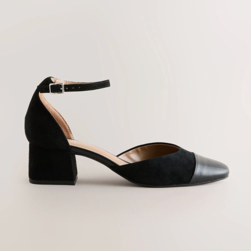A cut out of a pair of black block heels by Next
