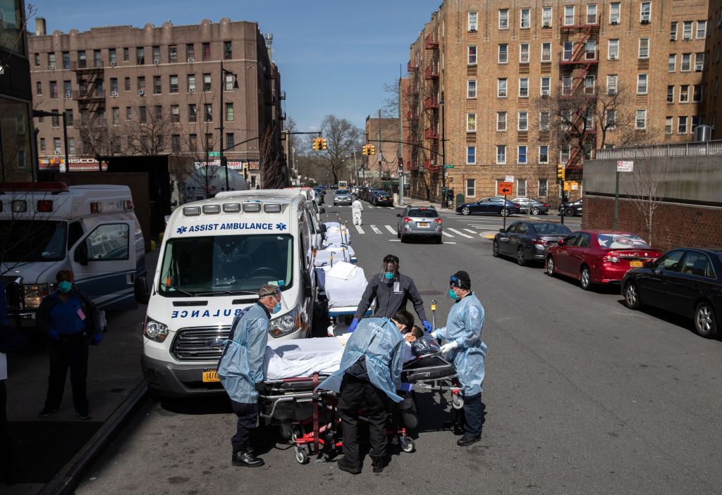 Hospital workers bring in a patient.