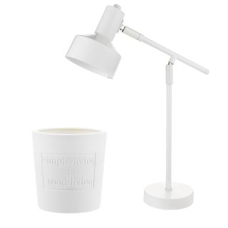 white table lamp and ceramic candle