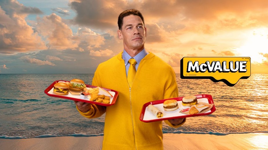 Man holding two trays of McDonald's foot items