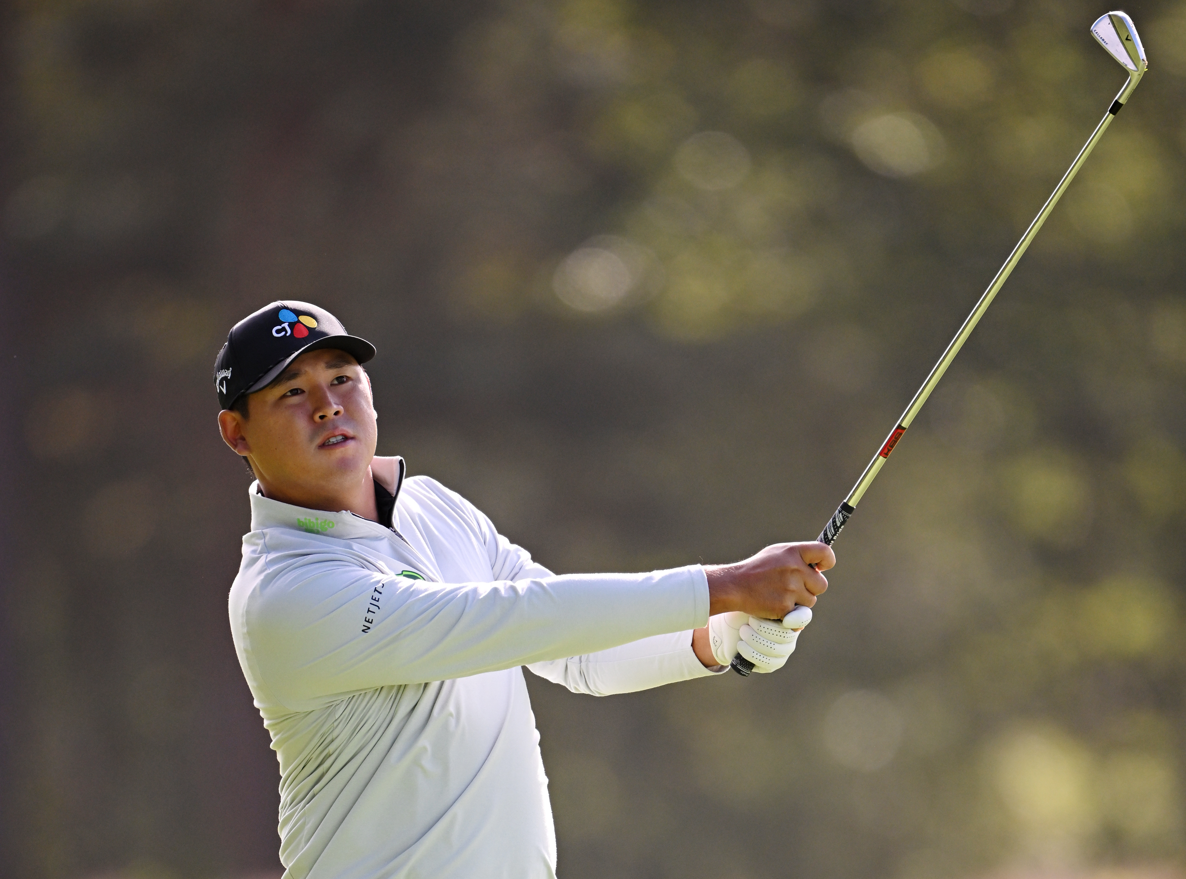 Si Woo Kim hits a wedge shot
