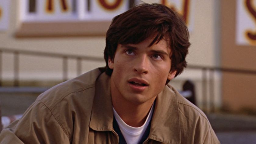 Clark Kent (Tom Welling) looks up at Lana Lang and Whitney Fordman on Smallville