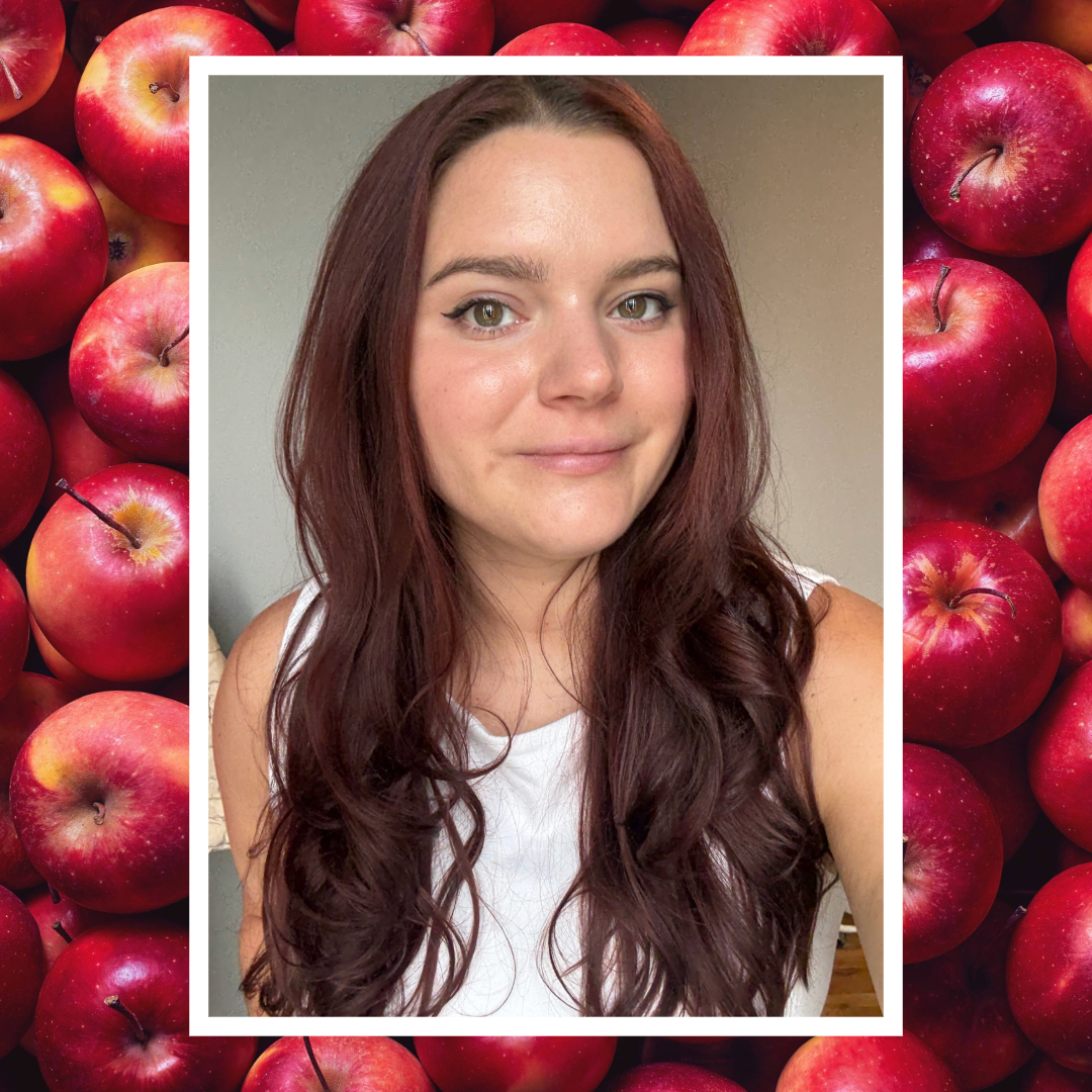 brooke knappenberger selfie with white border overlaid background of red apples 