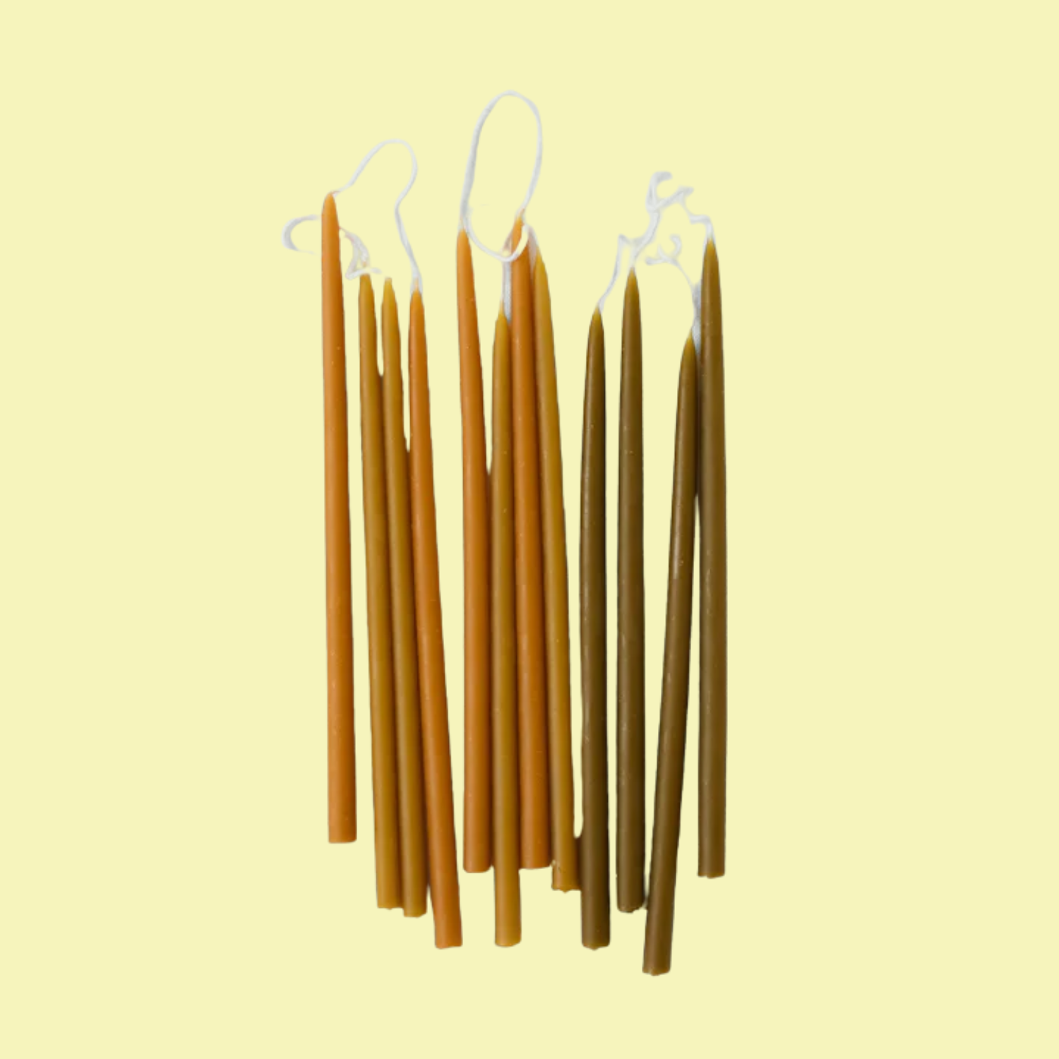 A bundle of brown and orange candles