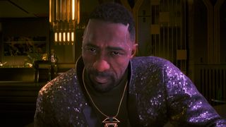 Idris Elba in Cyberpunk in snazzy jacket leaning forward