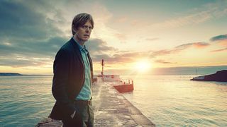 Kris Marshall as DI Humphrey Goodman in Beyond Paradise with a sea backdrop