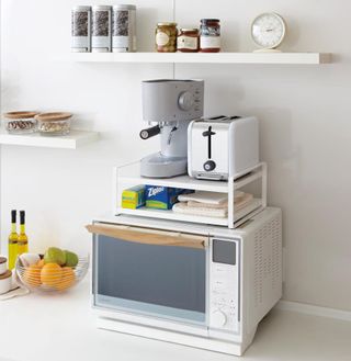 A microwave top shelving unit on a microwave by A Place For Everything
