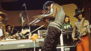 Miles Davis performs on stage with guitarist Reggie Lucas (right) at the Montreux Jazz Festival held in Montreux, Switzerland on July 08, 1973.