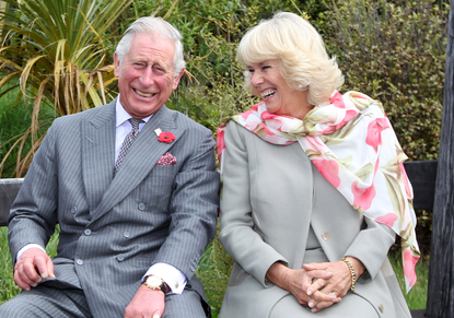 King Charles III and Queen Consort Camilla laughing
