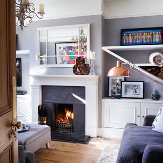 living room with wooden flooring and grey fireplace